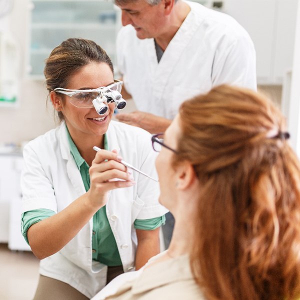 Dentist taking a closer look at a patient's teeth