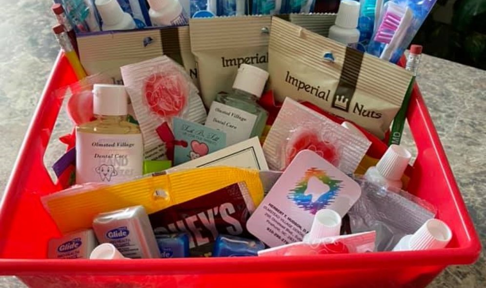 Gift basket filled with snacks and oral hygiene products