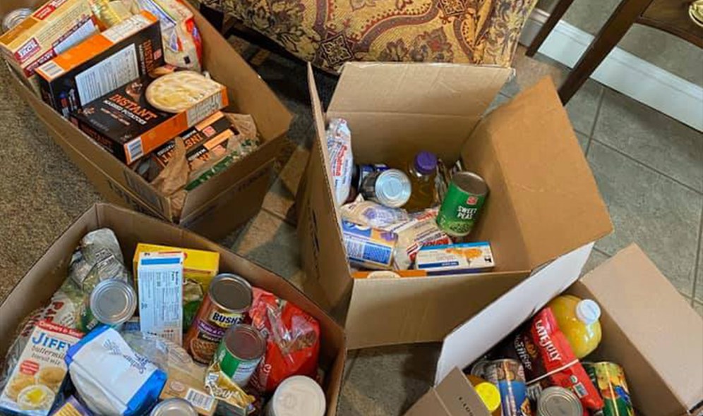 Boxes of food donated for the stuff the bus food drive