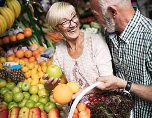 a mature couple shopping at a food market