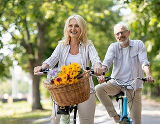 a mature couple enjoying a bike ride