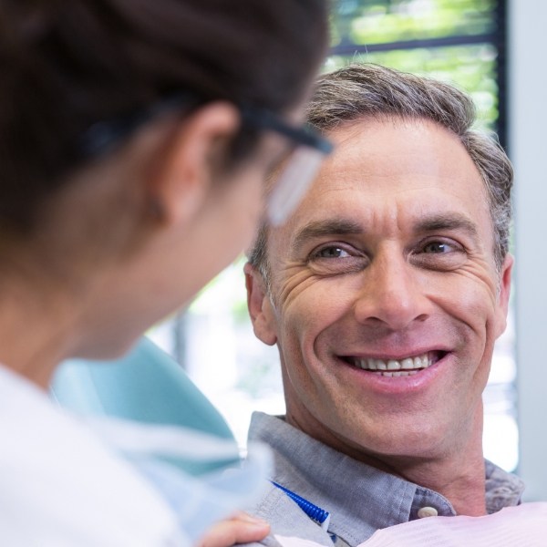 Man smiling during tooth extraction treatment