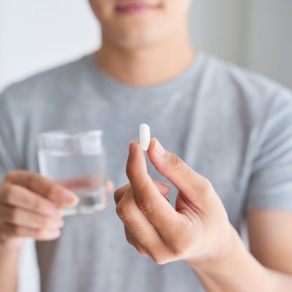 Patient taking oral conscious dental sedation pill