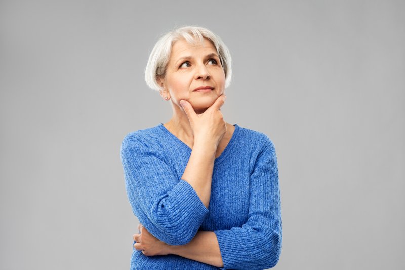 Older woman with questioning expression